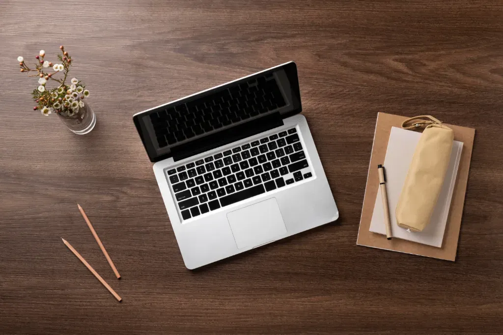laptop on wooden desk